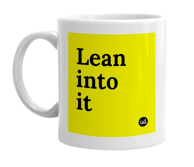 White mug with 'Lean into it' in bold black letters