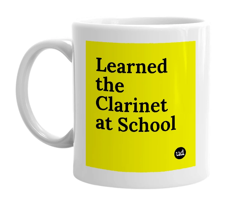 White mug with 'Learned the Clarinet at School' in bold black letters