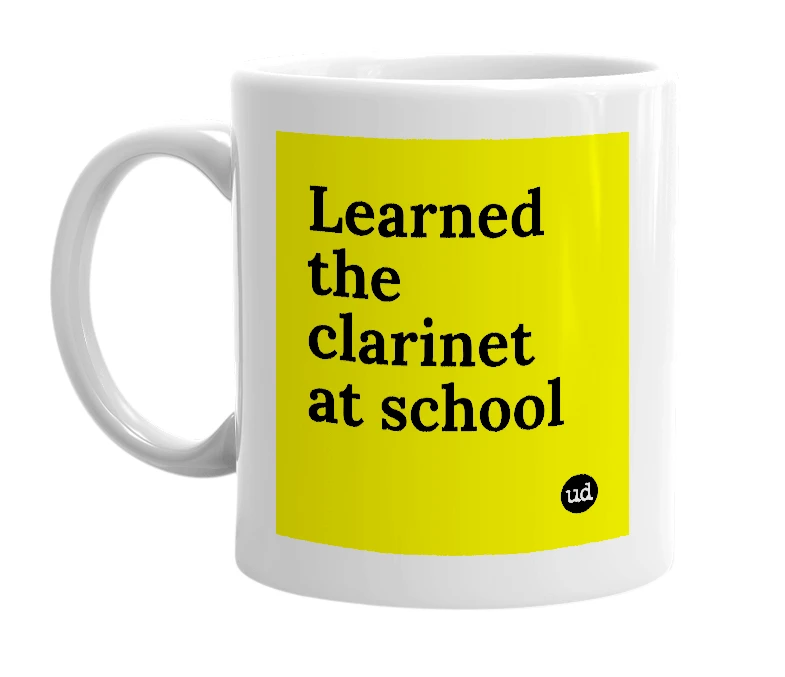 White mug with 'Learned the clarinet at school' in bold black letters