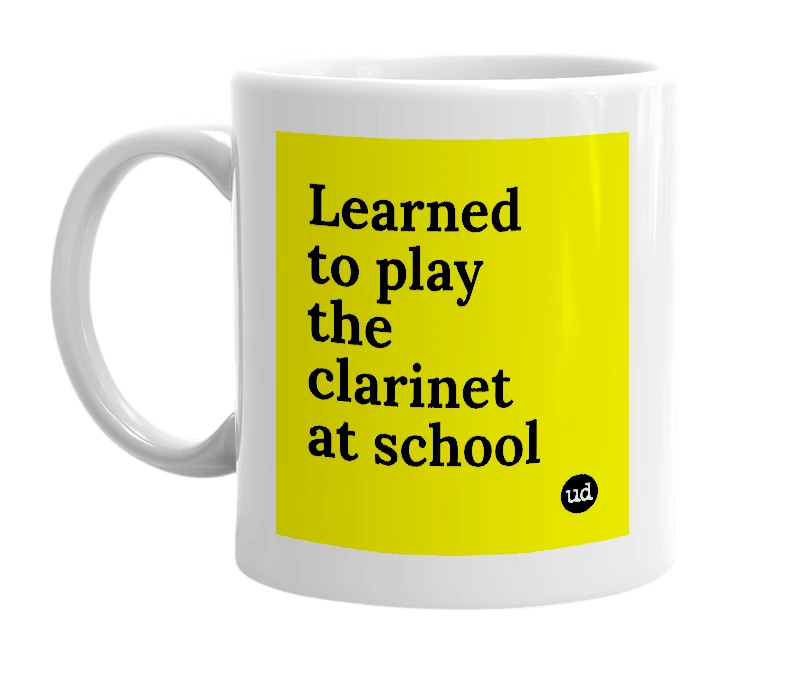 White mug with 'Learned to play the clarinet at school' in bold black letters