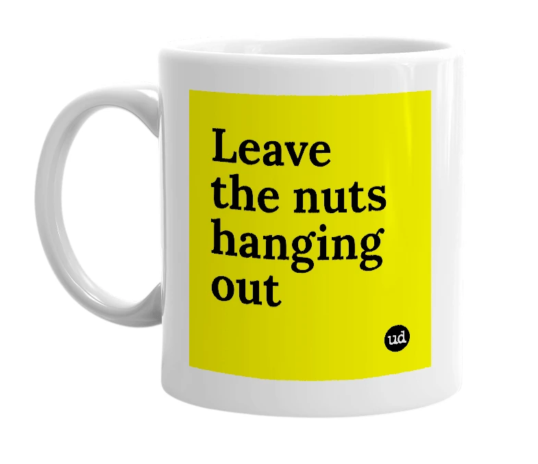 White mug with 'Leave the nuts hanging out' in bold black letters