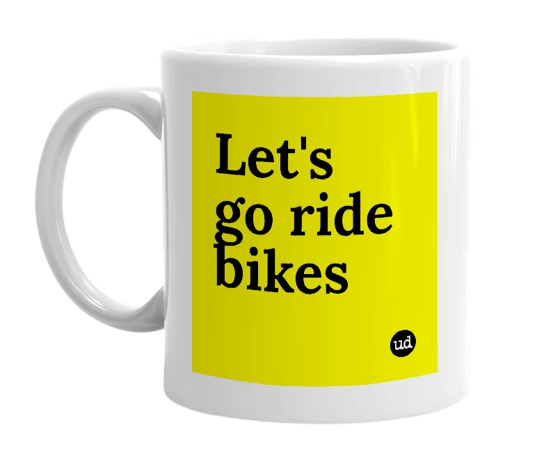 White mug with 'Let's go ride bikes' in bold black letters