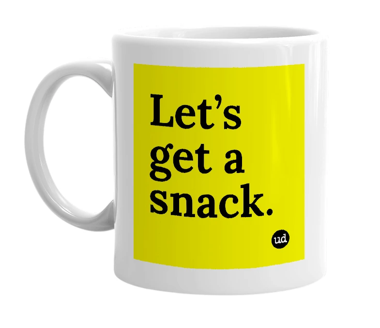 White mug with 'Let’s get a snack.' in bold black letters