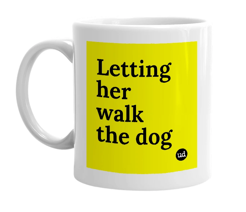 White mug with 'Letting her walk the dog' in bold black letters