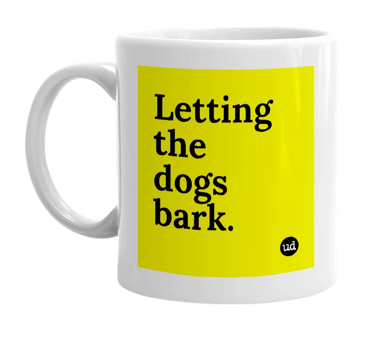 White mug with 'Letting the dogs bark.' in bold black letters