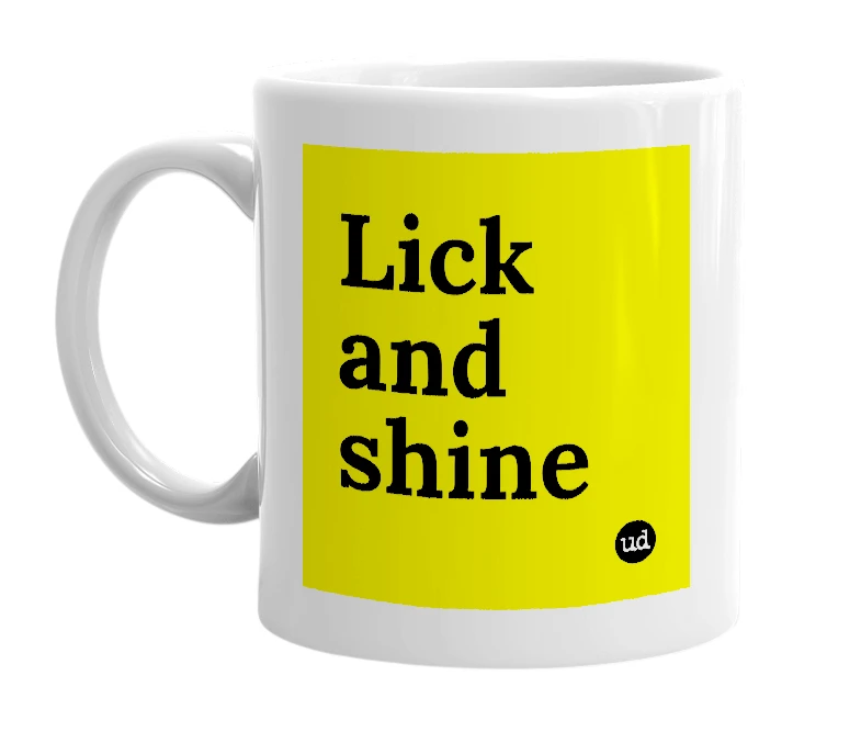 White mug with 'Lick and shine' in bold black letters