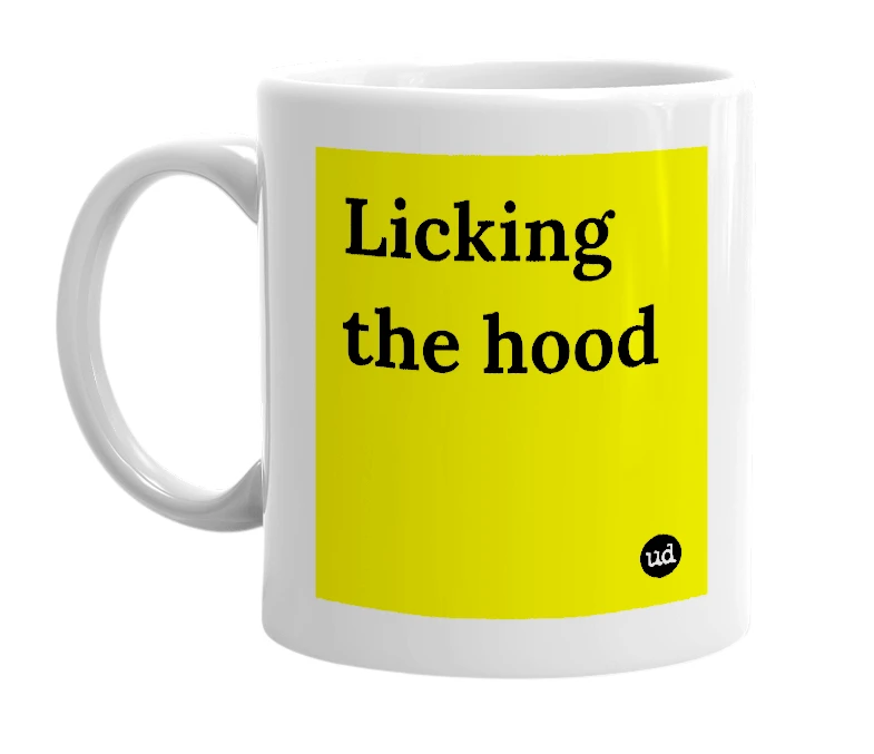White mug with 'Licking the hood' in bold black letters