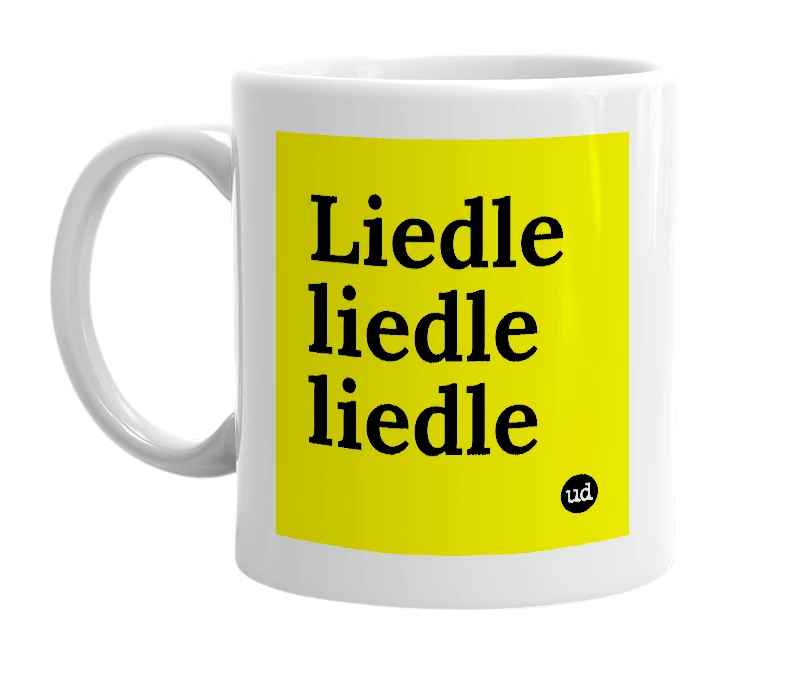 White mug with 'Liedle liedle liedle' in bold black letters