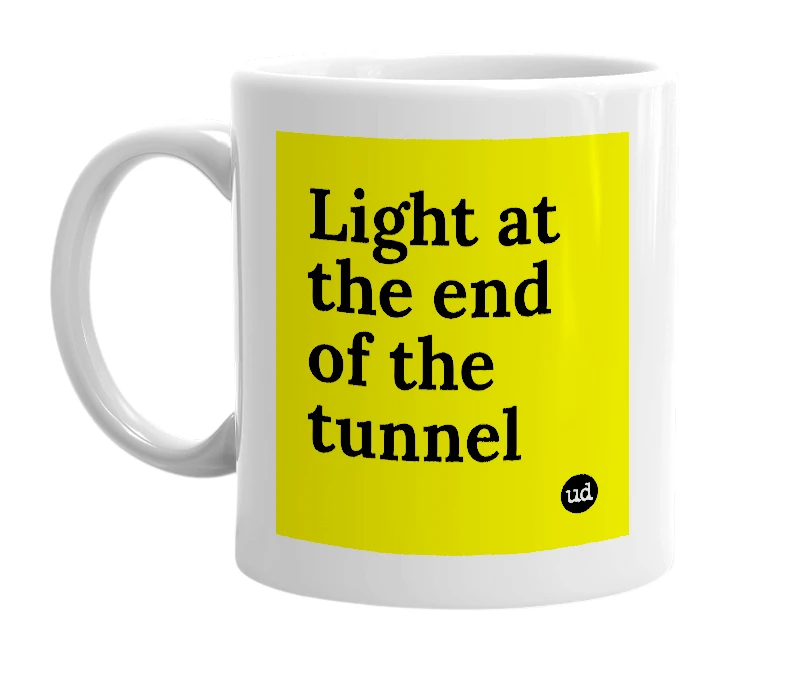 White mug with 'Light at the end of the tunnel' in bold black letters