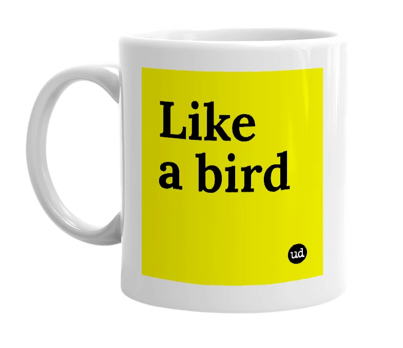 White mug with 'Like a bird' in bold black letters