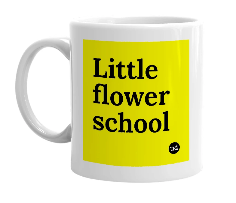 White mug with 'Little flower school' in bold black letters