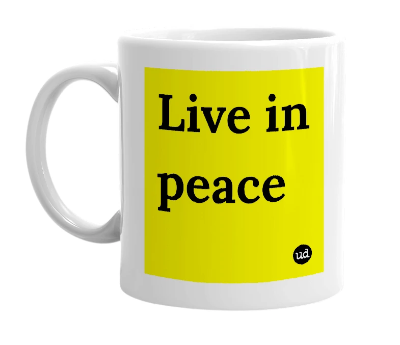 White mug with 'Live in peace' in bold black letters