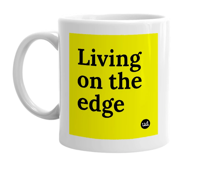 White mug with 'Living on the edge' in bold black letters