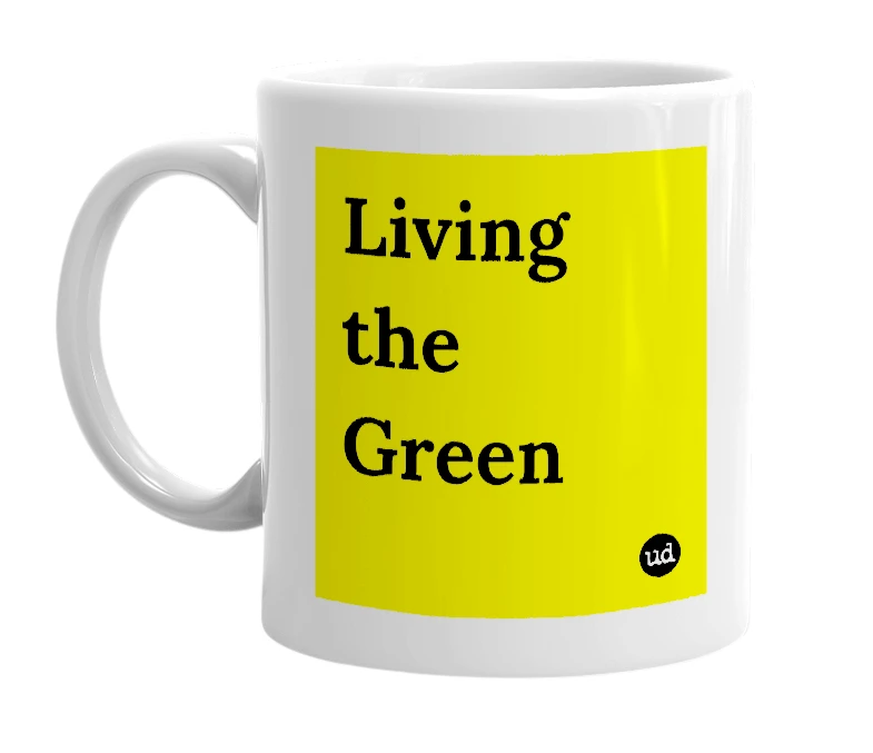 White mug with 'Living the Green' in bold black letters