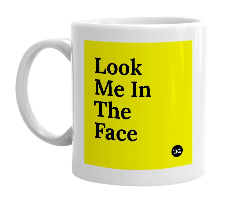 White mug with 'Look Me In The Face' in bold black letters
