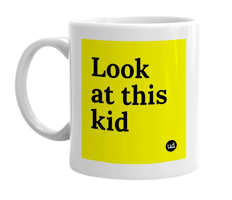 White mug with 'Look at this kid' in bold black letters