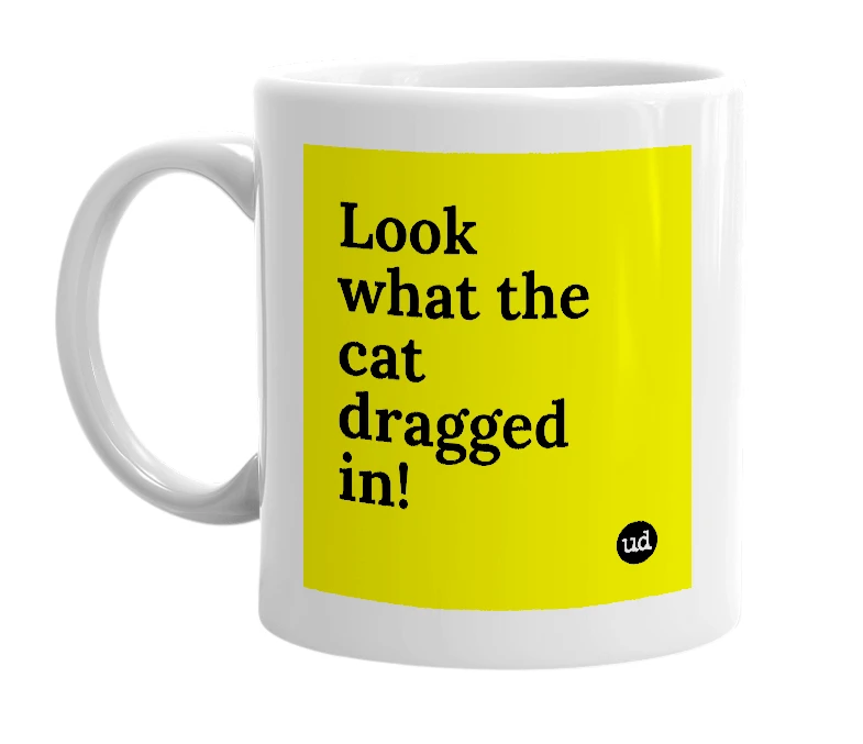 White mug with 'Look what the cat dragged in!' in bold black letters