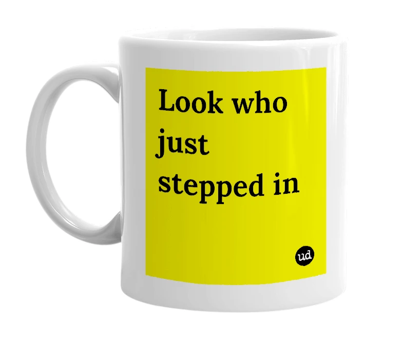 White mug with 'Look who just stepped in' in bold black letters