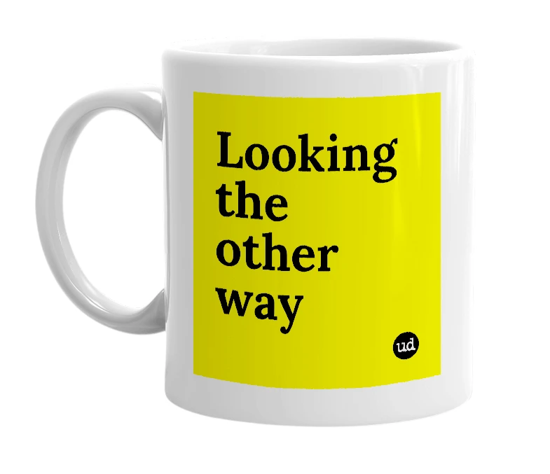 White mug with 'Looking the other way' in bold black letters