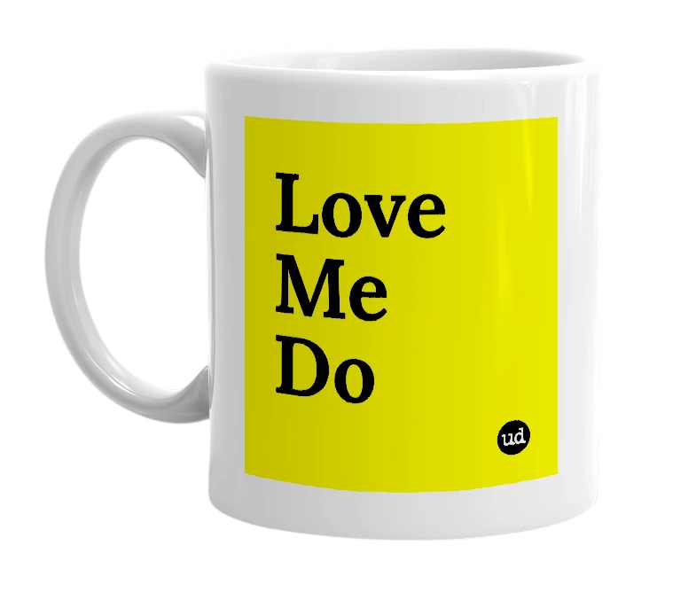 White mug with 'Love Me Do' in bold black letters