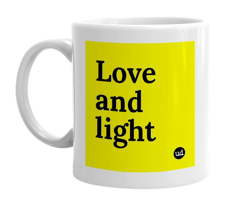 White mug with 'Love and light' in bold black letters