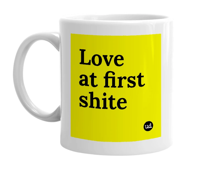 White mug with 'Love at first shite' in bold black letters