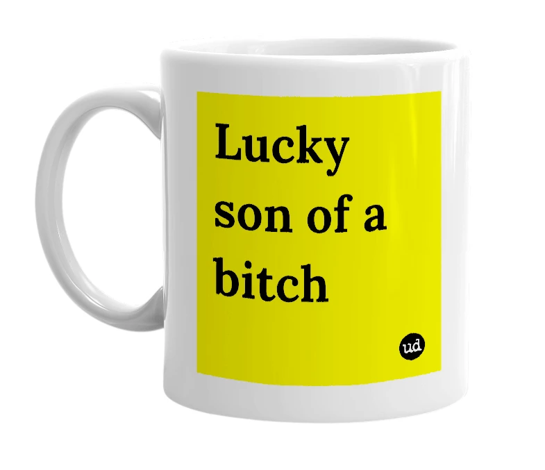 White mug with 'Lucky son of a bitch' in bold black letters