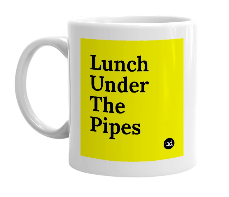 White mug with 'Lunch Under The Pipes' in bold black letters