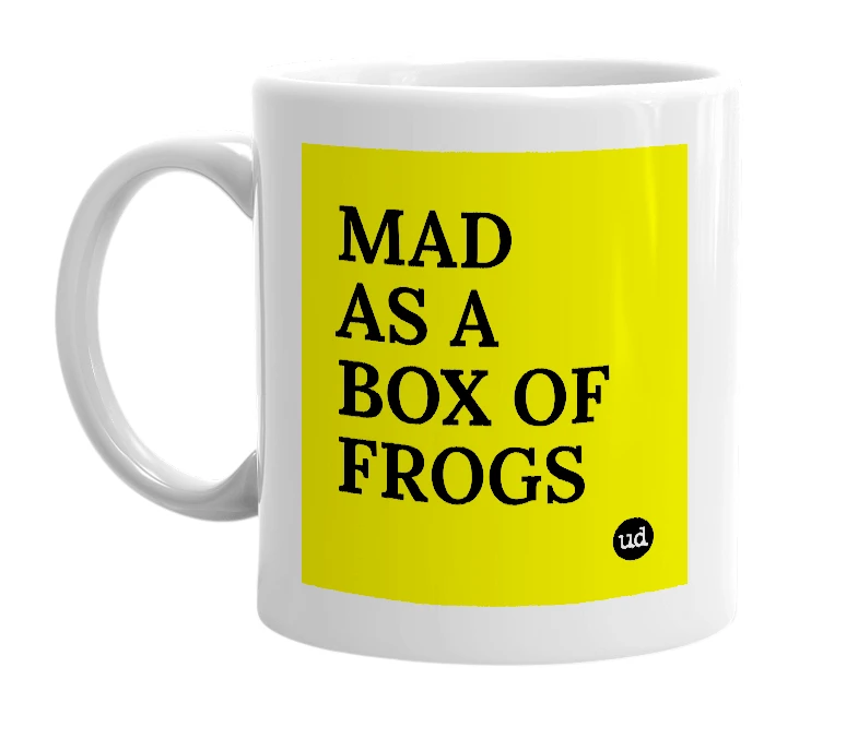 White mug with 'MAD AS A BOX OF FROGS' in bold black letters