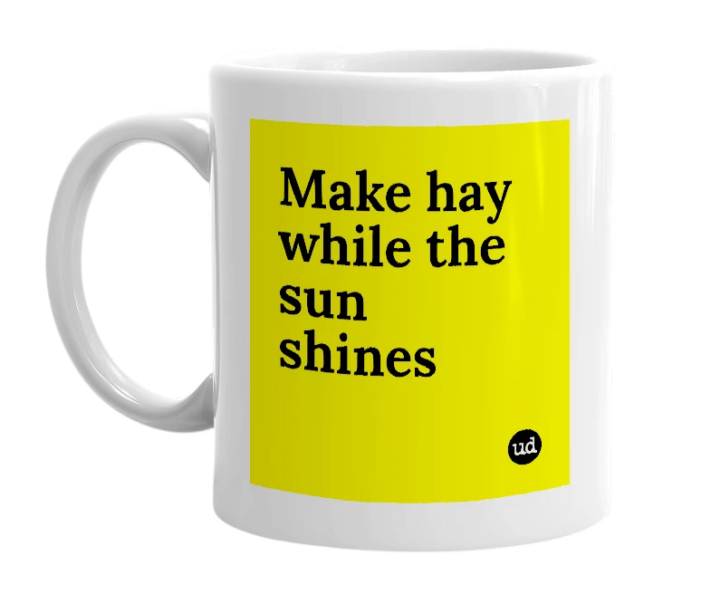 White mug with 'Make hay while the sun shines' in bold black letters
