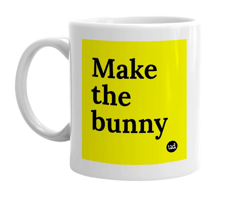 White mug with 'Make the bunny' in bold black letters