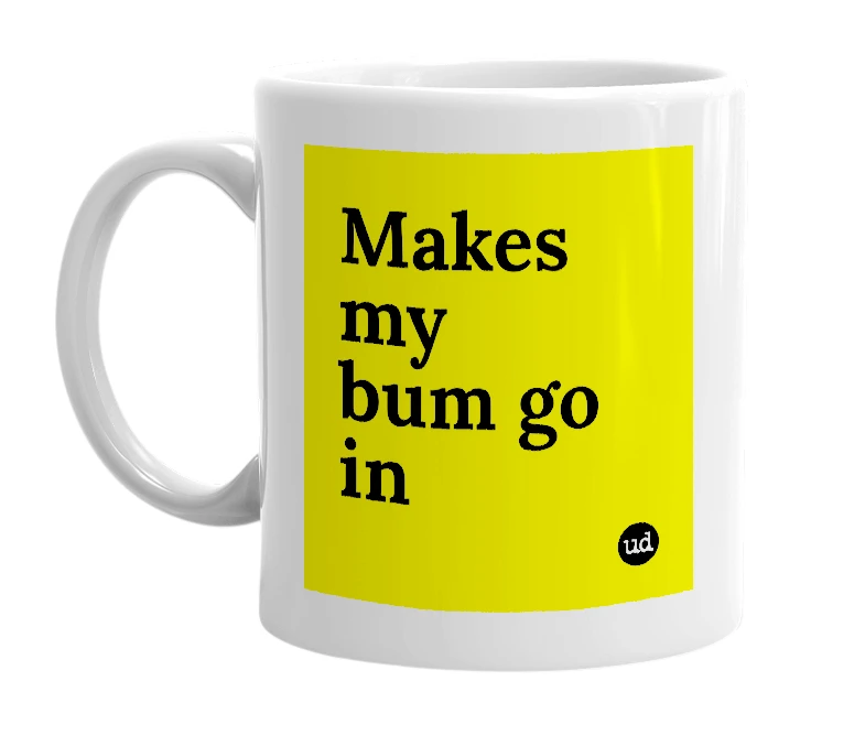 White mug with 'Makes my bum go in' in bold black letters