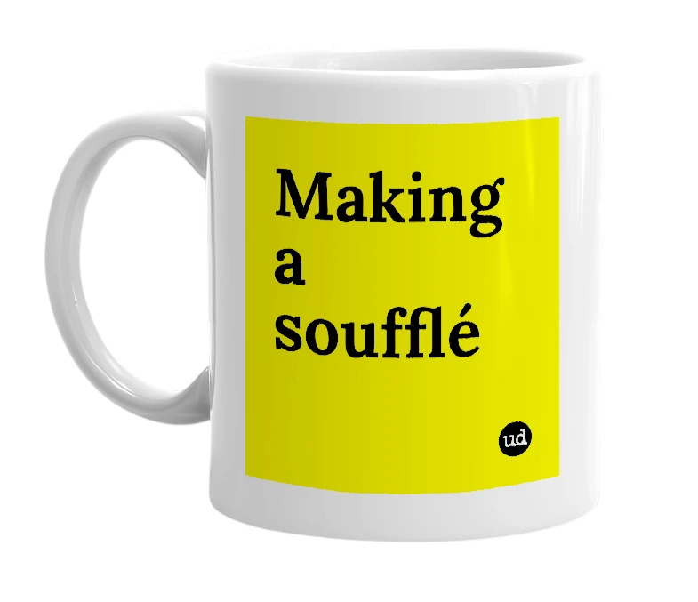 White mug with 'Making a soufflé' in bold black letters
