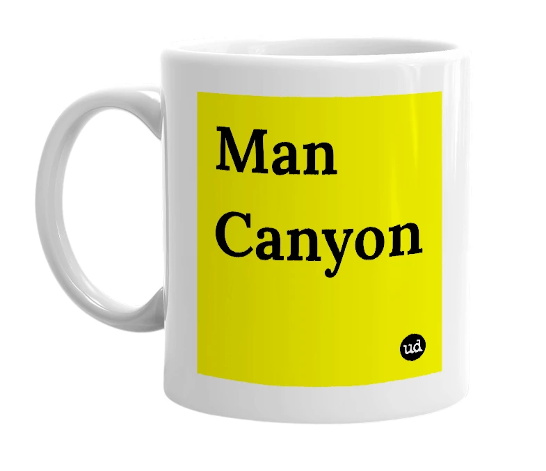 White mug with 'Man Canyon' in bold black letters