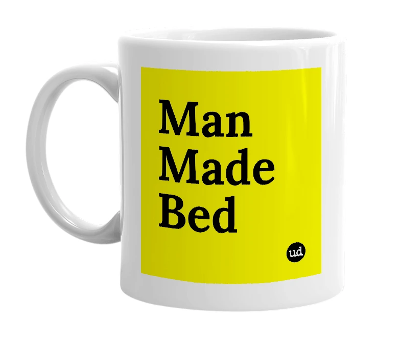 White mug with 'Man Made Bed' in bold black letters