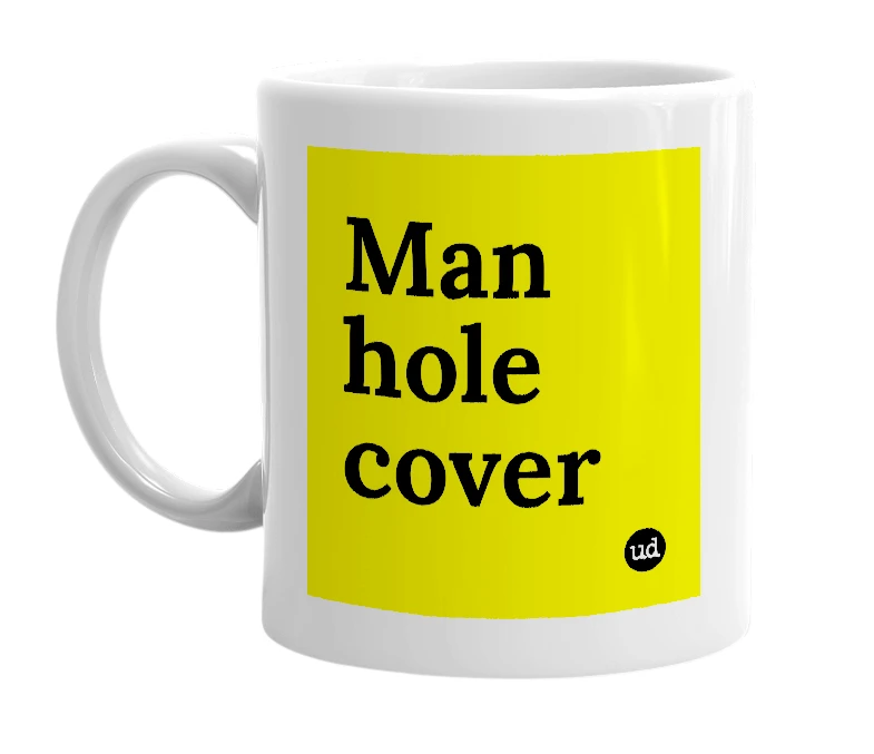 White mug with 'Man hole cover' in bold black letters