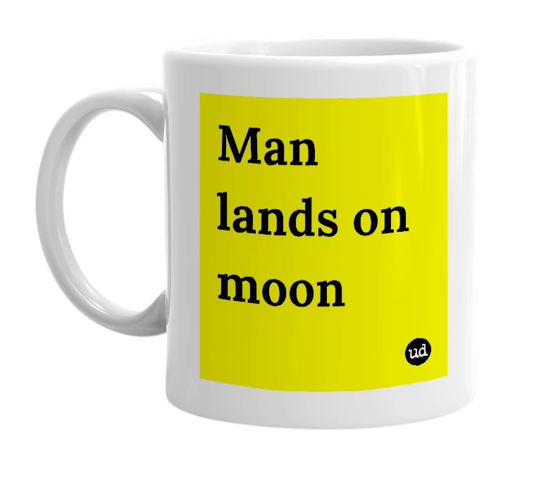 White mug with 'Man lands on moon' in bold black letters