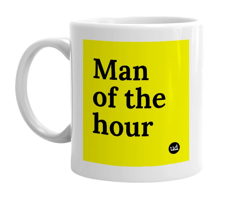 White mug with 'Man of the hour' in bold black letters