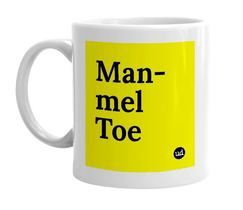 White mug with 'Man-mel Toe' in bold black letters