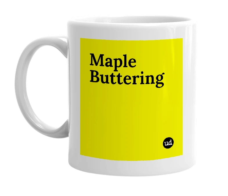 White mug with 'Maple Buttering' in bold black letters