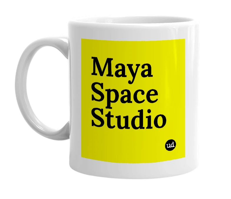 White mug with 'Maya Space Studio' in bold black letters