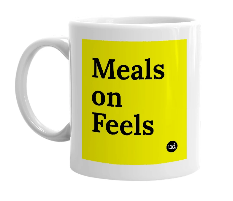 White mug with 'Meals on Feels' in bold black letters