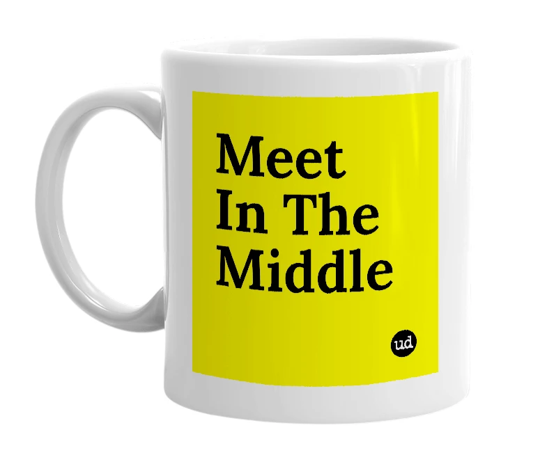 White mug with 'Meet In The Middle' in bold black letters