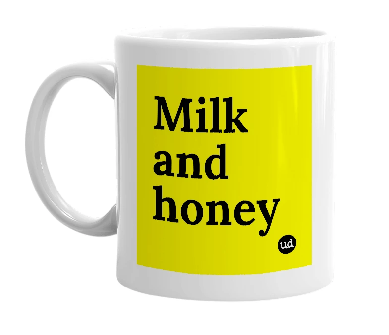 White mug with 'Milk and honey' in bold black letters