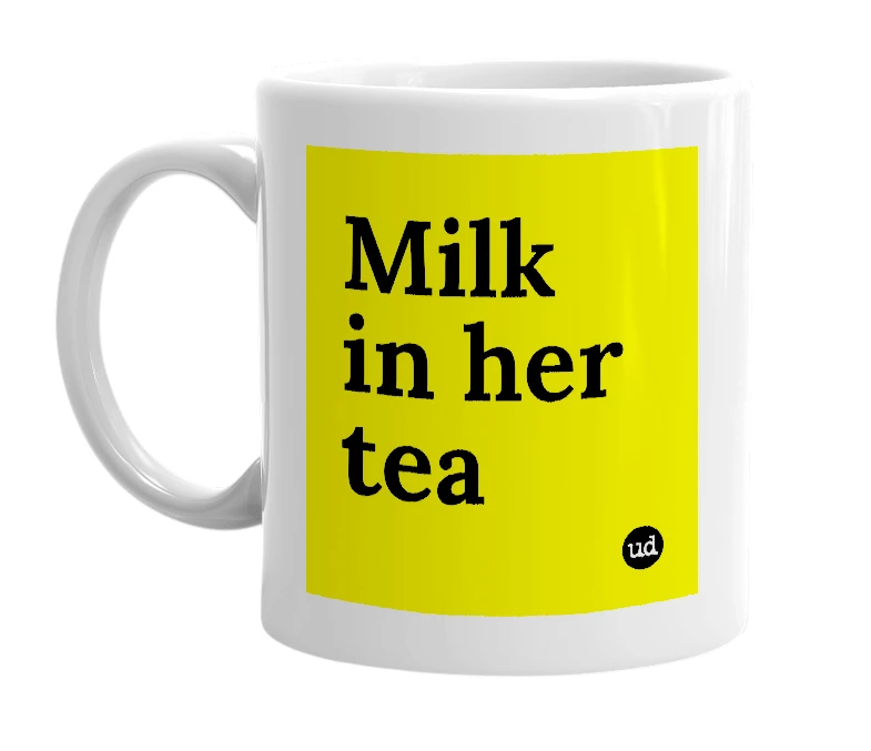 White mug with 'Milk in her tea' in bold black letters