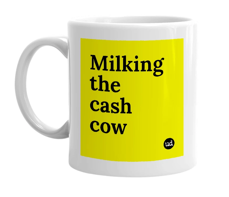 White mug with 'Milking the cash cow' in bold black letters
