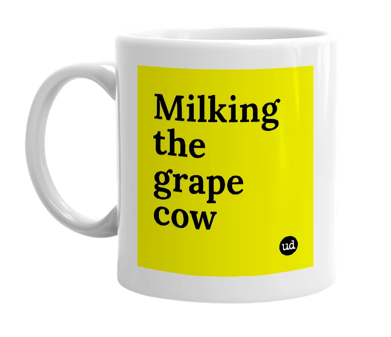White mug with 'Milking the grape cow' in bold black letters