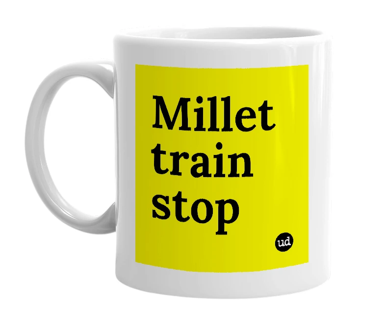 White mug with 'Millet train stop' in bold black letters