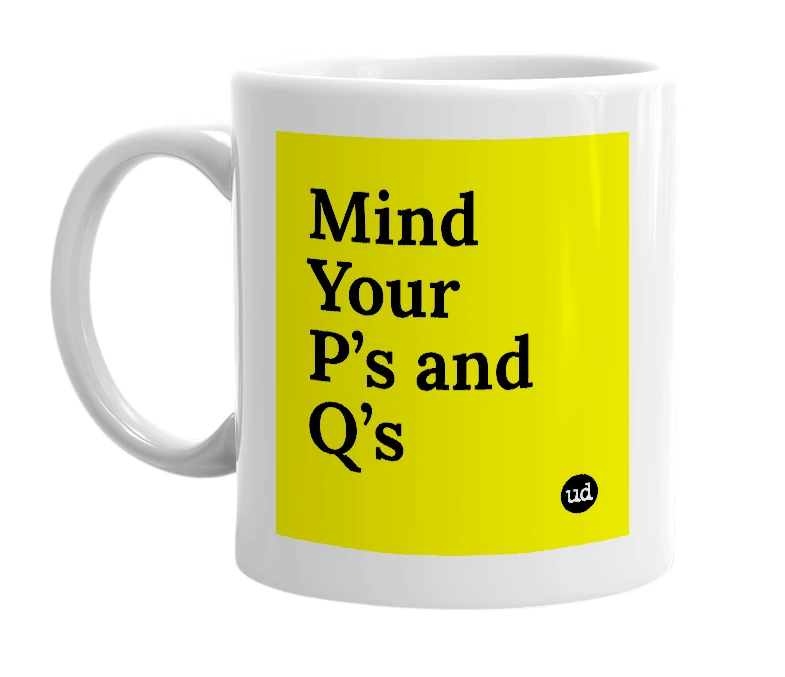 White mug with 'Mind Your P’s and Q’s' in bold black letters