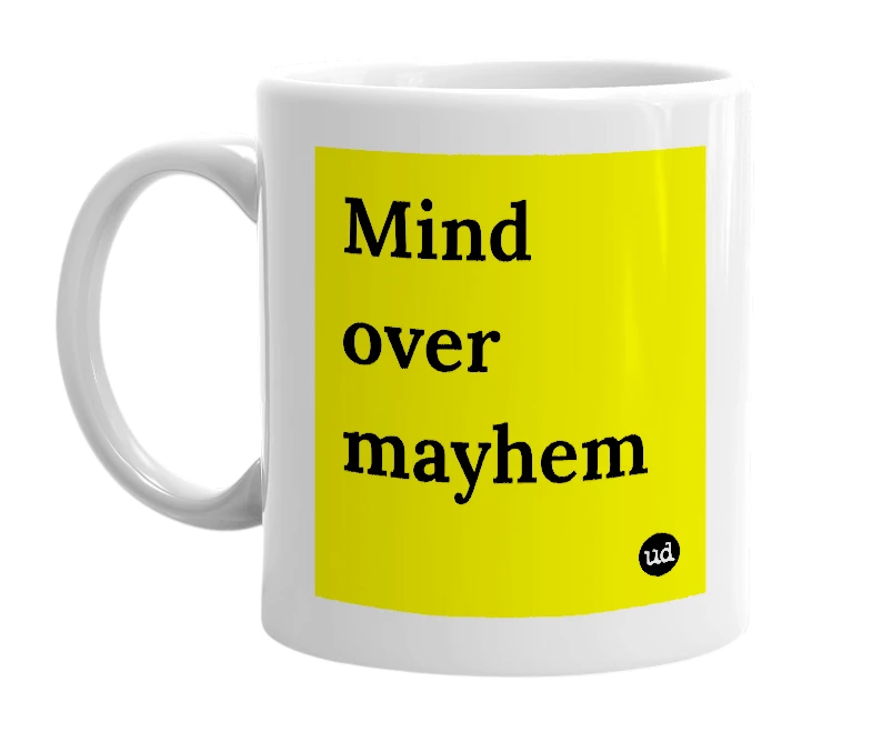 White mug with 'Mind over mayhem' in bold black letters
